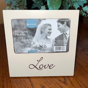 7' Square Picture Frame with the word LOVE on the front.  Holds 4' x 6" Photo